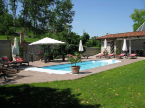 House with large terrace in a small residence with swimming pool surrounded by greenery